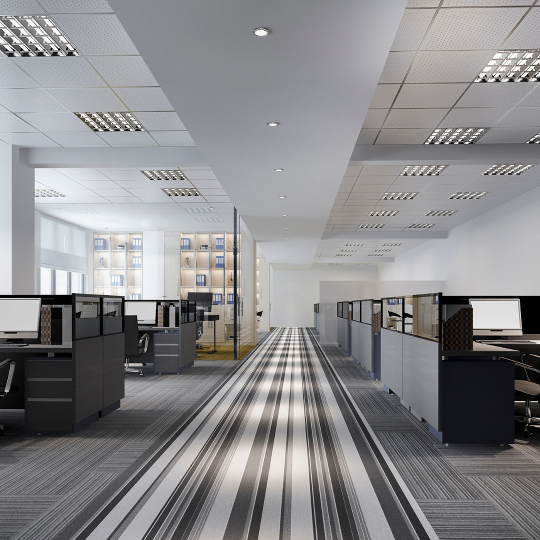 inside of an office building showing the grey and white cubicles and carpet after a strong cleaning