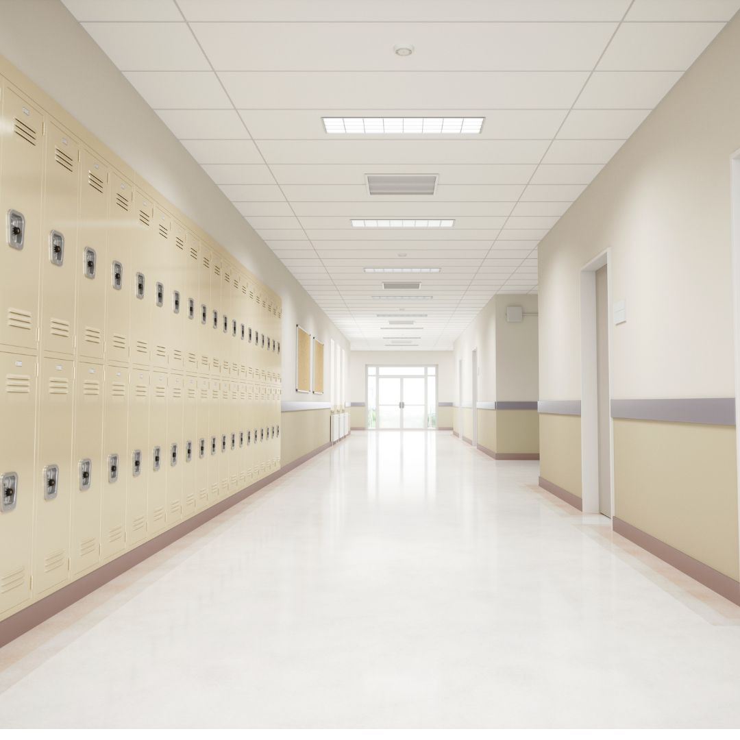 school hallway showing the white ceiling and floor with school lockers on the left side